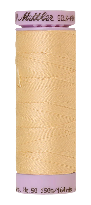 Parchment Mettler silk finish egyptian cotton 50WT (164 yd) thread spool. 9105-0140 alternate: 10550-0961